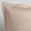 Cirillo Throw Pillow | Pearl | a close up of a pillow corner showing the flange framing quilted cotton sateen shot against a white background.