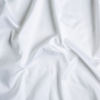 Bria Twin Flat Sheet | White | A close up of cotton sateen fabric in classic white.