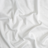 Bria Twin Flat Sheet | Winter White | A close up of cotton sateen fabric in winter white, softer and warmer in tone than classic white.