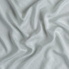 Madera Luxe Crib Sheet | Cloud | A close up of Tencel™ fabric in cloud, a soft, subtle sky blue-grey.