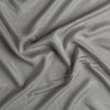Madera Luxe Crib Sheet | Fog | A close up of Tencel™ fabric in fog, a neutral-warm, soft mid-tone grey.