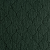 Austin Coverlet | Juniper | A close up of quilted midweight linen fabric in Juniper, a deep green tone.