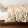Austin Duvet Cover | Honeycomb | Midweight linen duvet cover in honeycomb on a bed, side view.