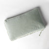 Harlow Throw Pillow | Eucalyptus | cotton velvet 15x24 pillow shot from overhead against a white background.
