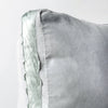Harlow Throw Pillow | Cloud | Corner detail close-up of cotton velvet 24 by 24 pillow, showcasing charmeuse gusset and raw edge trim.