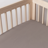 Bria Crib Sheet | French Lavender | a cotton sateen crib sheet shot into the inside corner of a nautral wood crib.