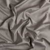 Bria Flat Sheet | Fog | A close up of cotton sateen fabric in fog, a neutral-warm, soft mid-tone grey.