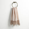 Frida Guest Towel | Pearl | Lace trimmed linen guest towel  draped through a decorative towel ring against a plain white background.