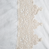 Linen Flat Sheet | Winter White | A close up of frida lace trimmed linen fabric in winter white, softer and warmer in tone than classic white.