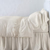 Linen Flat Sheet | Parchment | lace trimmed flat sheet shown with monochromatic bedding - side view.
