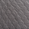 Harlow Coverlet | Moonlight | A close up of quilted cotton velvet fabric in moonlight, a saturated, cool, mid-dark grey tone.