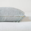 Ines Throw Pillow | Mineral | Close-up of brass zipper and charmeuse pull details on throw pillow - side view.