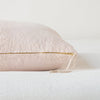 Ines Throw Pillow | Pearl | Close-up of brass zipper and charmeuse pull details on throw pillow - side view.