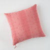 Ines Throw Pillow | Poppy | pillow on a white background - overhead view.