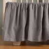 French Lavender | linen crib skirt shown on a crib without a mattress.