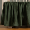 Juniper | linen crib skirt shown on a crib without a crib matress.