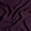 Linen Twin Duvet Cover | Fig | A close up of linen fabric in fig, a richly saturated purple-garnet.
