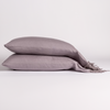 Linen Pillowcase (Single) | French Lavender | pair of lace trimmed pillowcases neatly stacked against a white background.