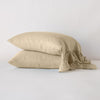 Linen Whisper Pillowcase (Single) | Honeycomb | Two sleeping pillows stacked at a slight angle against a plain background, showcasing ruffle trim detail - side view.
