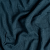 Linen Whisper Bed Skirt | Midnight | A close up of linen whisper fabric in midnight, a rich indigo tone.