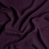 Linen Bed Skirt | Fig | A close up of linen fabric in fig, a richly saturated purple-garnet.
