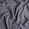 Linen Crib Skirt | French Lavender | a close up of linen fabric in french lavender, a neutral violet tone.