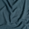 Linen Twin Flat Sheet | Midnight | A close up of linen fabric in midnight, a rich indigo tone.