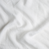 Linen Fitted Sheet | Winter White | A close up of linen fabric in winter white, softer and warmer in tone than classic white.