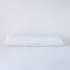 Linen Throw Pillow | White | bolster against a white background.