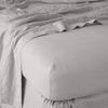 Linen Twin Fitted Sheets | Fog | close up of fitted sheet with matching rumpled flat sheet - corner view.