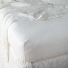 Linen Twin Fitted Sheets | Winter White | close up of fitted sheet with matching rumpled flat sheet - corner view.