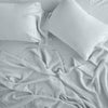 Linen Flat Sheet | Cloud | Rumpled sheeting with matching sleeping pillows - overhead view.