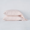 Linen Standard Pillowcase (Single) | Pearl | Two sleeping pillows neatly stacked against a white background - side view.