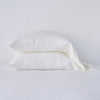 Linen Standard Pillowcase (Single) | Winter White | Two sleeping pillows neatly stacked against a white background - side view.