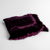 Loulah Baby Blanket | Fig | an overhead shot of a folded silk velvet baby blanket with a raw-edged eyelash ruffle detail.