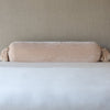 Loulah Throw Pillow | Pearl | bolster shown against neutral background and white foreground