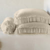 Loulah Sham | Parchment | Two shams stacked flat next to matching bolster. Close-up side view highlights the ruffle trim.