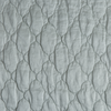 Luna Sham | Cloud | A close up of quilted charmeuse fabric in cloud, a soft, subtle sky blue-grey.