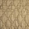 Luna Twin Coverlet | Honeycomb | A close up of quilted charmeuse fabric in honeycomb, a warm golden tone.