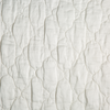 Luna Sham | Winter White | A close up of quilted charmeuse fabric in winter white, softer and warmer in tone than classic white.