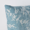 Lynette Throw Pillow | Cloud | Corner detail close-up, highlighting two-tone embroidery and linen back.