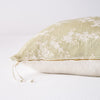 Lynette Throw Pillow | Parchment | Close-up side vew featuring brass zipper with charmeuse pull and linen back.
