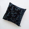 Lynette Throw Pillow | Midnight | pillow against a plain background - overhead view.