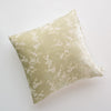 Lynette Throw Pillow | Parchment | pillow against a plain background - overhead view.
