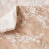 Lynette Blanket | Pearl | Close up of blanket, with a corner turned back to showcase the linen back - overhead view.