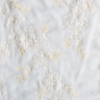 Lynette Sham | White | A close up of embroidered silk velvet fabric in classic white.