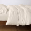 Madera Luxe Duvet Cover | Parchment | duvet cover with matching sleeping pillow and fitted sheet - side view.