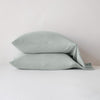 Madera Luxe Pillowcase (Single) | Madera Luxe sleeping pillows in eucalyptus, stacked neatly against a white backdrop - side view.