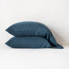 Madera Luxe Pillowcase (Single) | Midnight | sleeping pillows stacked neatly against a white backdrop - side view.