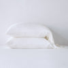 Madera Luxe Pillowcase (Single) | Winter White | sleeping pillows stacked neatly against a white backdrop - side view.